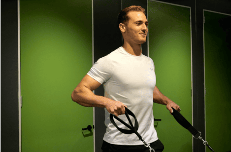 A patient doing resistance exercise with an exercise physiologist